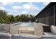 Backyard pool area featuring comfortable lounge seating and a fountain feature for ambiance at 125 Smyrna Dr, Debary, FL 32713