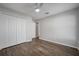 Bedroom with laminate wood floors, closet, and a ceiling fan at 1253 Bramley Ln, Deland, FL 32720