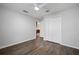 Bedroom with laminate wood floors, closet, and an ensuite bathroom at 1253 Bramley Ln, Deland, FL 32720