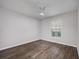 Bedroom featuring laminate wood floors and a bright window at 1253 Bramley Ln, Deland, FL 32720