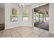 Dining area featuring tile floors and sliding glass doors to the lanai at 1253 Bramley Ln, Deland, FL 32720