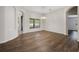 Spacious dining room with laminate wood floors and a charming chandelier at 1253 Bramley Ln, Deland, FL 32720