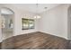 Bright dining room featuring laminate wood floors and a charming chandelier at 1253 Bramley Ln, Deland, FL 32720