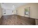 Bright living room featuring vaulted ceiling, neutral paint, and wood-look flooring at 1253 Bramley Ln, Deland, FL 32720