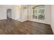 Inviting living room features laminate flooring, abundant natural light, and neutral paint at 1253 Bramley Ln, Deland, FL 32720