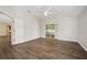 Large main bedroom with vaulted ceiling, wood-look floors and sliding glass doors at 1253 Bramley Ln, Deland, FL 32720