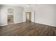 Spacious main bedroom features wood-look floors and doorway to en-suite bathroom at 1253 Bramley Ln, Deland, FL 32720