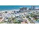 Scenic aerial view of a beachside community, dotted with hotels, homes, and lush palm trees at 130 Harrison Rd, Daytona Beach, FL 32118