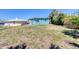 Grassy backyard with home exterior providing a serene outdoor retreat at 130 Harrison Rd, Daytona Beach, FL 32118