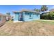Backyard with teal exterior, offering outdoor relaxation and entertaining space at 130 Harrison Rd, Daytona Beach, FL 32118