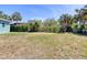 Expansive backyard with mature trees creating a private outdoor space at 130 Harrison Rd, Daytona Beach, FL 32118
