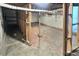 Unfinished basement with concrete flooring and exposed beams offering potential for customization at 130 Harrison Rd, Daytona Beach, FL 32118