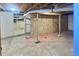 Unfinished basement with concrete flooring and exposed beams ready for customization at 130 Harrison Rd, Daytona Beach, FL 32118