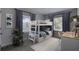 Functional ' bedroom with a bunk bed, a study area, and a playful rug, maximizing space and comfort at 130 Harrison Rd, Daytona Beach, FL 32118