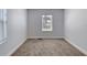 Empty bedroom with neutral carpet and natural light from window at 130 Harrison Rd, Daytona Beach, FL 32118