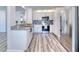 Modern kitchen featuring white cabinets, stainless steel appliances, and granite countertops at 130 Harrison Rd, Daytona Beach, FL 32118