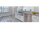 Farmhouse sink with granite countertops and stainless steel dishwasher at 130 Harrison Rd, Daytona Beach, FL 32118