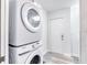 This laundry room features a stacked washer and dryer, plus easy access to the exterior at 130 Harrison Rd, Daytona Beach, FL 32118