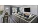 Bright living room with stylish furnishings, including a plush sofa, modern TV, and refreshing natural light at 130 Harrison Rd, Daytona Beach, FL 32118