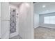 Modern bathroom features updated tile shower and glass accents at 130 Harrison Rd, Daytona Beach, FL 32118