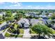 Aerial view showcases the property with its manicured lawn in the neighborhood at 13944 Huntwick Dr, Orlando, FL 32837