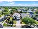 Aerial view showcases the property with its manicured lawn in the neighborhood at 13944 Huntwick Dr, Orlando, FL 32837
