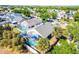 Aerial view showcasing the property with its screened-in pool and surrounding neighborhood at 13944 Huntwick Dr, Orlando, FL 32837