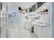 Bright, white bathroom with double vanity, soaking tub, and ample storage at 13944 Huntwick Dr, Orlando, FL 32837