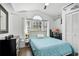 Cozy bedroom boasts natural light, vaulted ceiling, and a decorative window at 13944 Huntwick Dr, Orlando, FL 32837