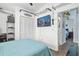 This charming bedroom is decorated with a coastal theme and features a flat screen TV at 13944 Huntwick Dr, Orlando, FL 32837