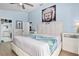 Spacious bedroom featuring a white leather headboard and plenty of natural light at 13944 Huntwick Dr, Orlando, FL 32837