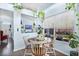Cozy dining nook with hardwood floors, plants, and lots of natural light, perfect for casual meals at 13944 Huntwick Dr, Orlando, FL 32837