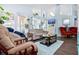 Comfortable living room features hardwood floors, plenty of seating, and an open concept perfect for entertaining guests at 13944 Huntwick Dr, Orlando, FL 32837