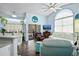 Bright living room with tile floors, vaulted ceilings, and plenty of natural light, creating a welcoming atmosphere at 13944 Huntwick Dr, Orlando, FL 32837
