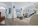 Spacious living room with hardwood floors, vaulted ceilings, and large windows offering plenty of natural light at 13944 Huntwick Dr, Orlando, FL 32837