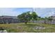 Fenced backyard with tree and grass at 1408 E Normandy Blvd, Deltona, FL 32725