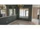 Dining area showcasing neutral tones, sleek tile flooring, and a large window for optimal lighting at 1408 E Normandy Blvd, Deltona, FL 32725