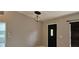 Entryway with sleek door, decorative lighting, and access to the laundry room at 1408 E Normandy Blvd, Deltona, FL 32725