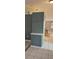 Hallway view with neutral colored wall and a partial view of kitchen with breakfast seating at 1408 E Normandy Blvd, Deltona, FL 32725
