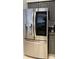 Close-up of a modern stainless steel refrigerator with water dispenser and storage at 1408 E Normandy Blvd, Deltona, FL 32725