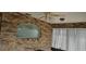 Enclosed sunroom featuring brick accent wall and custom window at 1408 E Normandy Blvd, Deltona, FL 32725