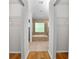 Hallway view of primary bathroom featuring double closets, garden tub, and tile flooring at 1439 Bent Oaks Blvd, Deland, FL 32724