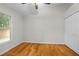 Bedroom with hardwood floors, window, and closet providing comfortable living at 1439 Bent Oaks Blvd, Deland, FL 32724