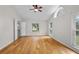 Spacious bedroom features hardwood floors, ceiling fan, large windows and neutral wall colors at 1439 Bent Oaks Blvd, Deland, FL 32724