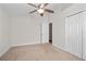 This bedroom features a ceiling fan and closet, offering functionality and comfort at 1439 Bent Oaks Blvd, Deland, FL 32724