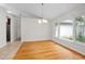 Dining area showcasing hardwood floors and ample natural lighting at 1439 Bent Oaks Blvd, Deland, FL 32724
