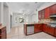Spacious kitchen with stainless steel appliances, granite countertops, tile floors and a breakfast nook at 1439 Bent Oaks Blvd, Deland, FL 32724