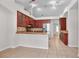 Spacious kitchen features wood cabinetry, granite countertops, stainless steel appliances and tile flooring at 1439 Bent Oaks Blvd, Deland, FL 32724