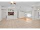Open living space with tile floors, ceiling fan, and bar that overlooks the kitchen at 1439 Bent Oaks Blvd, Deland, FL 32724