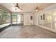 Enclosed patio features tile flooring, ceiling fans, and screened windows, offering comfort and relaxation at 1439 Bent Oaks Blvd, Deland, FL 32724
